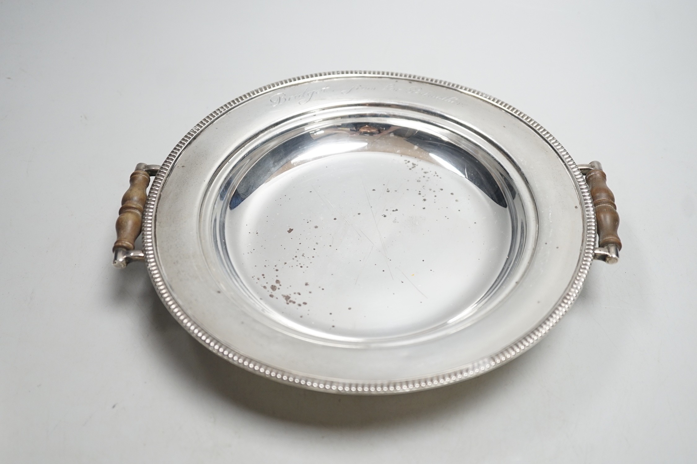 A George V silver circular two handled warming dish and cloche, by J. Parkes & Co, London, 1930, with engraved inscription, width 20.8cm, gross weight 34.4oz.